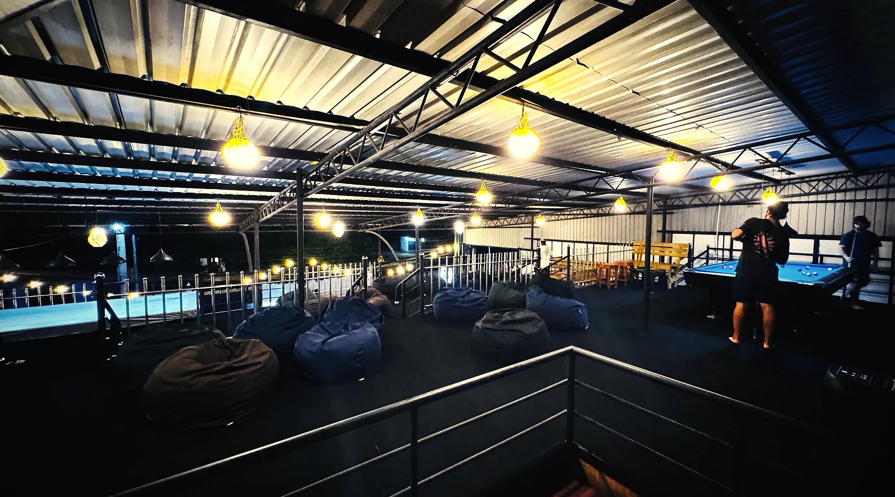 Beanbags and festoon lights on Meyola's upper deck after dark